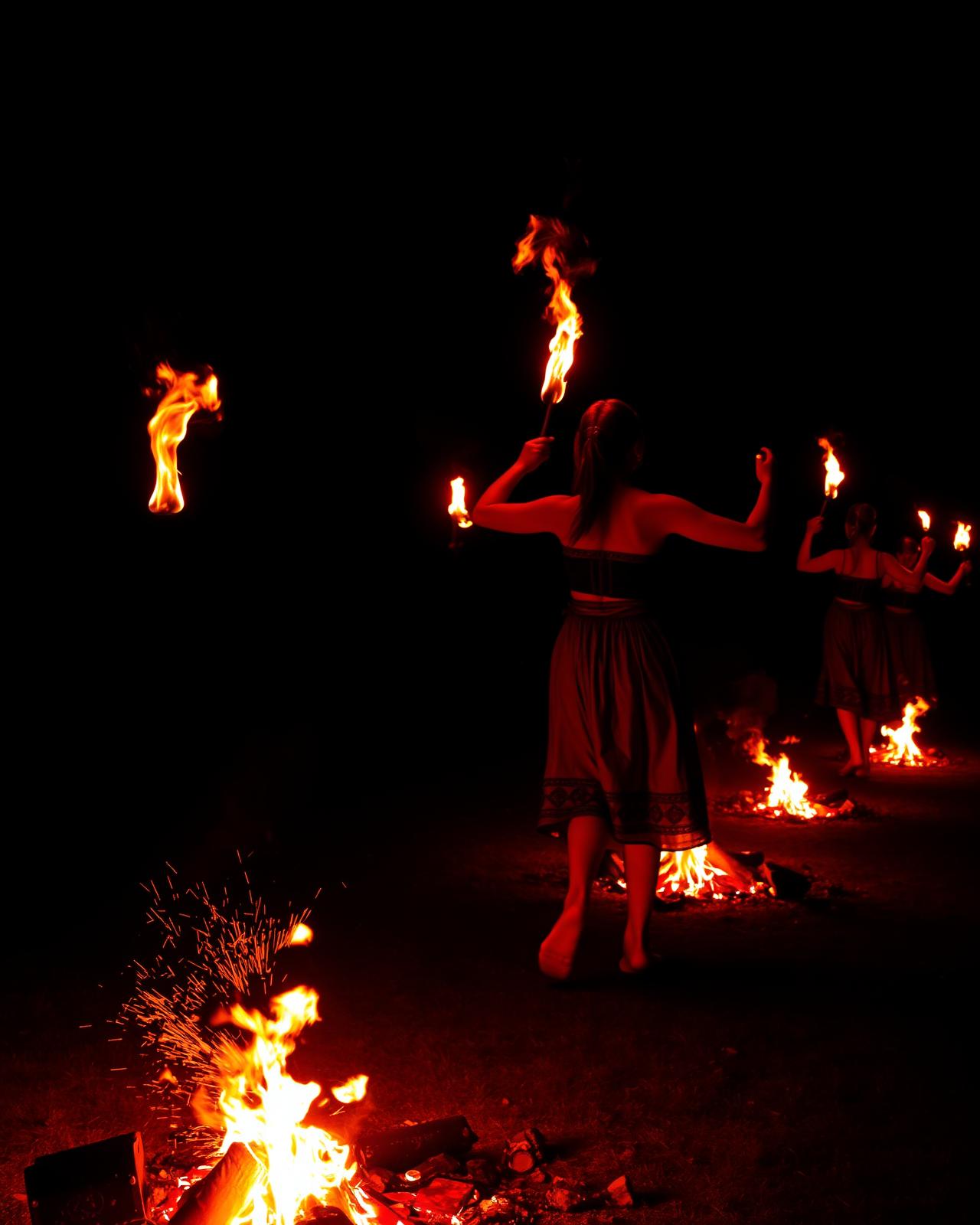 Fire dancers on glowing embers in a Strandzha village square