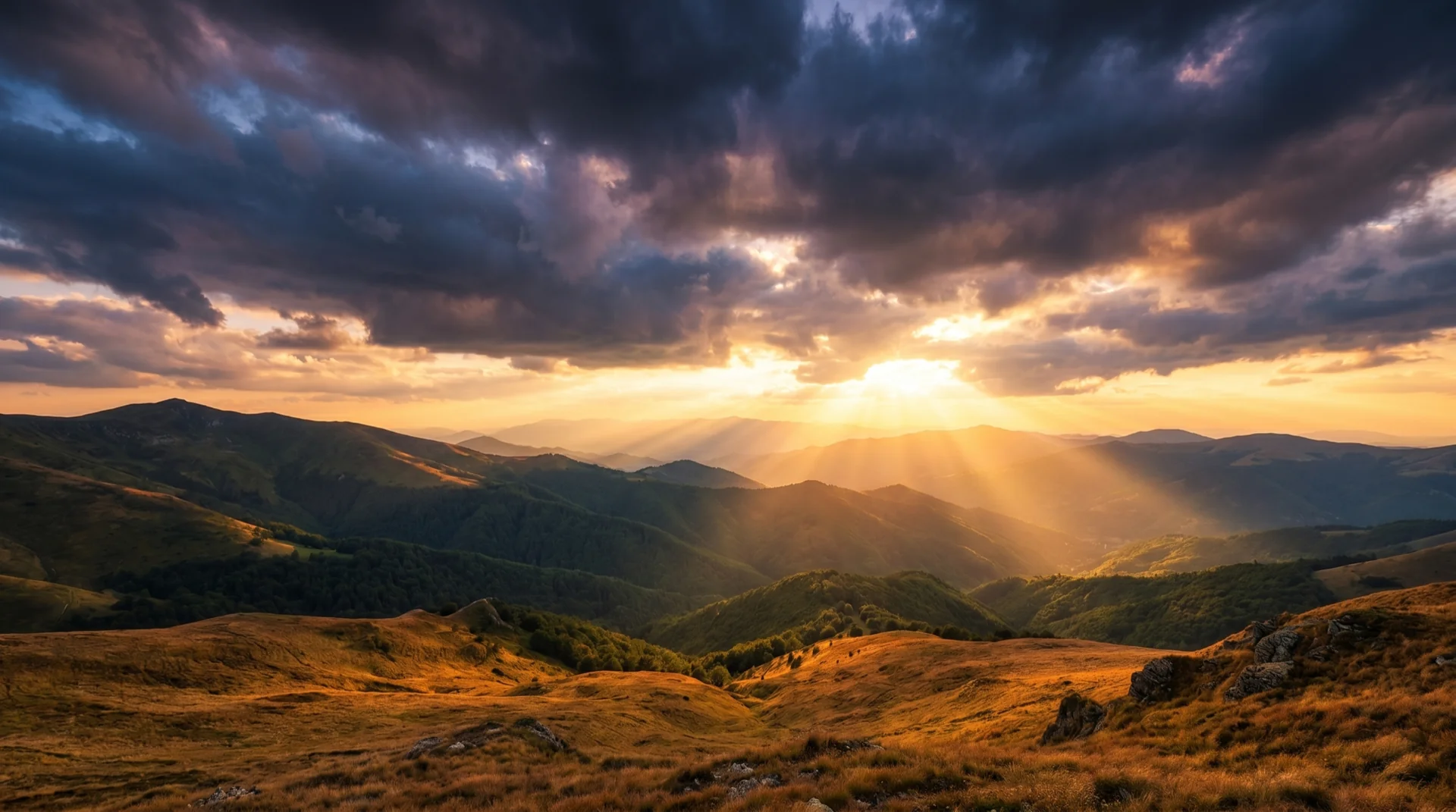 Sun rays breaking through storm clouds over Bulgarian mountains